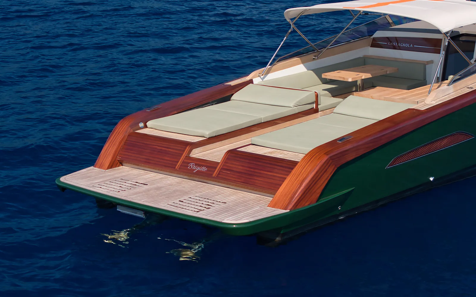 Classic Riva Ariston mahogany teak stern on turquoise water — Italian yacht craftsmanship and heritage